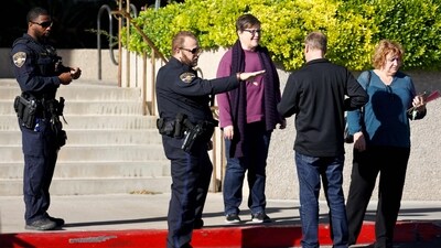 LAS VEGAS, NEVADA - DECEMBER 07: University police officers escort people on campus the morning after a shooting left three dead at the University of Nevada, Las Vegas campus on December 07, 2023 in Las Vegas, Nevada. (Mario Tama/Getty Images/AFP (Photo by MARIO TAMA / GETTY IMAGES NORTH AMERICA / Getty Images via AFP) LAS VEGAS, NEVADA - DECEMBER 07: University police officers escort people on campus the morning after a shooting left three dead at the University of Nevada, Las Vegas campus on December 07, 2023 in Las Vegas, Nevada. (Mario Tama/Getty Images/AFP (Photo by MARIO TAMA / GETTY IMAGES NORTH AMERICA / Getty Images via AFP)