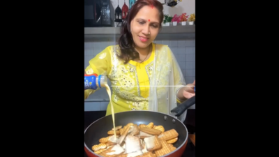 Woman making halwa with biscuits. Woman making halwa with biscuits.