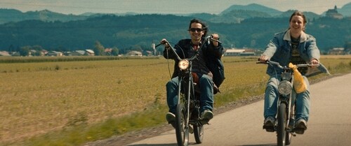This 2022 Slavic film, set in 1999, narrates the tale of two friends who take to a road trip on their mopeds while looking for freedom and love. This 2022 Slavic film, set in 1999, narrates the tale of two friends who take to a road trip on their mopeds while looking for freedom and love.