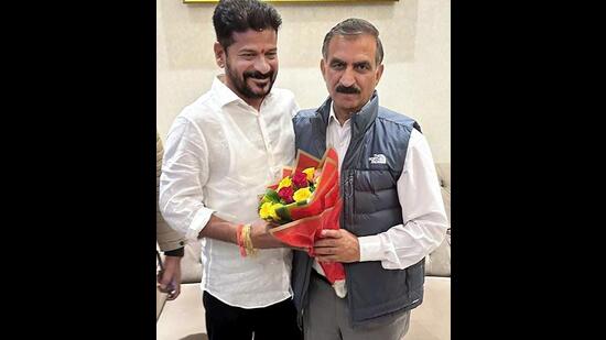 Himachal Pradesh chief minister Sukhvinder Singh Sukhu being greeted by Telangana chief minister Revanth Reddy as he arrives to attend the latter's swearing-in ceremony in Hyderabad on Thursday. (HT Photo)