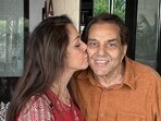 Hema Malini and Dharmendra share a cute moment at his birthday party. Hema Malini and Dharmendra share a cute moment at his birthday party.