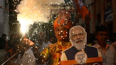 Bharatiya Janata Party (BJP) supporters celebrate with poster of PM Narendra Modi after getting majority in Rajasthan, Madhya Pradesh and Chattisgarh Assembly Election at BJP Party Office in Kolkata. (Hindustan Times) Bharatiya Janata Party (BJP) supporters celebrate with poster of PM Narendra Modi after getting majority in Rajasthan, Madhya Pradesh and Chattisgarh Assembly Election at BJP Party Office in Kolkata. (Hindustan Times)