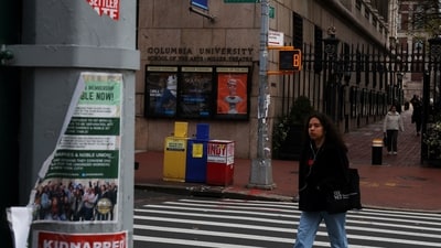 Torn signs hang from a light pole, amid the ongoing conflict between Israel and the Palestinian Islamist group Hamas, across from the Lerner Pedestrian Gate of Columbia University in the Manhattan borough of New York City, U.S., December 5, 2023.  REUTERS/Shannon Stapleton (REUTERS)