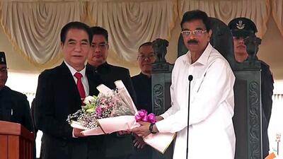 Mizoram governor Hari Babu Kambhampati (in white clothes) and Zoram People's Movement leader Lalduhoma during the swearing-in ceremony of Lalduhoma as the new chief minister of Mizoram at the Raj Bhavan complex on Friday. (ANI)