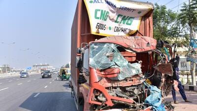 The mangled remains of the truck. Police said the truck driver was speeding and could not spot the carelessly parked broken down bus on the highway in time to avoid it. (Sakib Ali/HT Photo) The mangled remains of the truck. Police said the truck driver was speeding and could not spot the carelessly parked broken down bus on the highway in time to avoid it. (Sakib Ali/HT Photo)