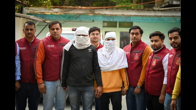 The two arrested gangsters at Crime Branch office in Delhi’s RK Puram on Friday. (Sanchit Khanna/HT Photo) The two arrested gangsters at Crime Branch office in Delhi’s RK Puram on Friday. (Sanchit Khanna/HT Photo)