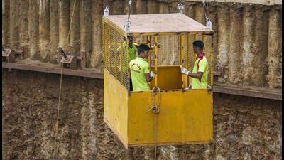 Two men had been trapped inside a 60-foot trench in Chennai for nearly four days after the heavy rains brought by Cyclone Michaung caused a cave-in at a construction site. (PTI) Two men had been trapped inside a 60-foot trench in Chennai for nearly four days after the heavy rains brought by Cyclone Michaung caused a cave-in at a construction site. (PTI)