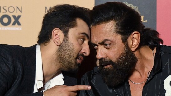 Bollywood actors Ranbir Kapoor (L), Bobby Deol (R) attend the promotion of Animal in Mumbai on November 30. (AFP)