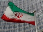 Iran nuclear deal: An Iranian flag flutters in front of the International Atomic Energy Agency (IAEA) headquarters in Vienna, Austria.