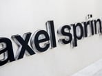 The logo of German publisher Axel Springer is seen outside its headquarters in Berlin August 7, 2013. 