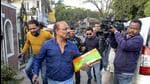 Income Tax officials come out from the residence of Jharkhand Congress MP Dheeraj Sahu in Ranchi Saturday. (PTI)
