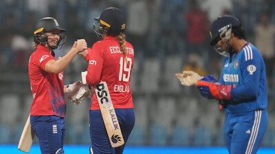 Mumbai: England women players Heather Knight and Sophie Ecclestone celebrate after winning the 2nd T20 International match over India Women, at Wankhede Stadium in Mumbai (PTI) Mumbai: England women players Heather Knight and Sophie Ecclestone celebrate after winning the 2nd T20 International match over India Women, at Wankhede Stadium in Mumbai (PTI)