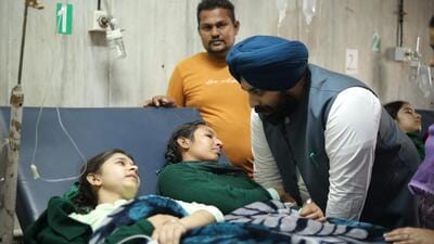 Punjab education minister Harjot Singh Bains interacting with school students hospitalised in Sangrur on December 2. (HT file photo)