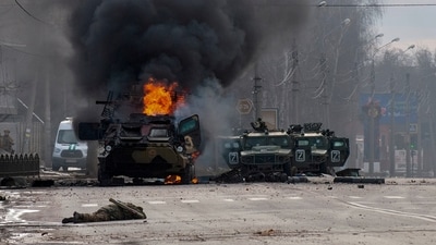 FILE - An armored personnel carrier burns and damaged Russian light utility vehicles stand abandoned after fighting in Kharkiv, Ukraine, on Feb. 27, 2022. Vladimir Putin on Friday Dec. 8, 2023 moved to prolong his repressive and unyielding grip on Russia for another six years, announcing his candidacy in the 2024 presidential election that he is all but certain to win. (AP Photo/Andrew Marienko, File) (AP) FILE - An armored personnel carrier burns and damaged Russian light utility vehicles stand abandoned after fighting in Kharkiv, Ukraine, on Feb. 27, 2022. Vladimir Putin on Friday Dec. 8, 2023 moved to prolong his repressive and unyielding grip on Russia for another six years, announcing his candidacy in the 2024 presidential election that he is all but certain to win. (AP Photo/Andrew Marienko, File) (AP)