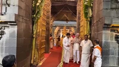 RJD chief Lalu Yadav is seen walking out of the temple after concluding the visit. He is accompanied by a group of people as he leaves the temple. (X/ANI) RJD chief Lalu Yadav is seen walking out of the temple after concluding the visit. He is accompanied by a group of people as he leaves the temple. (X/ANI)