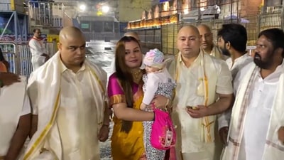Tejashwi Yadav along with his wife and daughter inside the Venkateswara temple in Tirupati. Tejashwi is seen holding the ‘prasad’ as he poses for the picture. (X/ANI) Tejashwi Yadav along with his wife and daughter inside the Venkateswara temple in Tirupati. Tejashwi is seen holding the ‘prasad’ as he poses for the picture. (X/ANI)