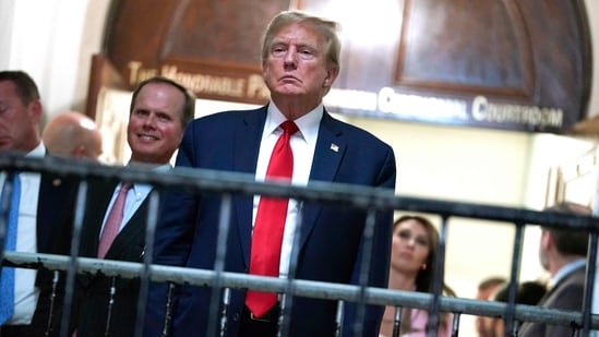 Former US President Donald Trump, the frontrunner for the 2024 Republican presidential nomination, and his two eldest sons are accused of inflating the value of their real estate assets to receive more favorable bank loans and insurance terms. (Photo by TIMOTHY A. CLARY / AFP) (AFP)
