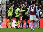 Arsenal's German midfielder #29 Kai Havertz argues with Aston Villa's Argentinian goalkeeper #01 Emiliano Martinez during the English Premier League football match between Aston Villa and Arsenal at Villa Park