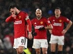 Manchester United's Portuguese midfielder #08 Bruno Fernandes (L) reacts after they concede their second goal during the English Premier League football match