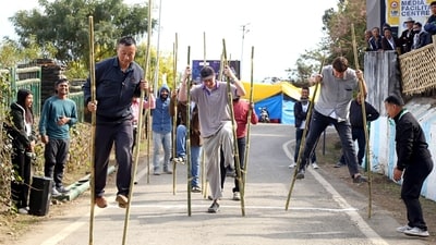 Foreigners participate in a bamboo stick race in the Hornbill festival in Kohima. (ANI) Foreigners participate in a bamboo stick race in the Hornbill festival in Kohima. (ANI)