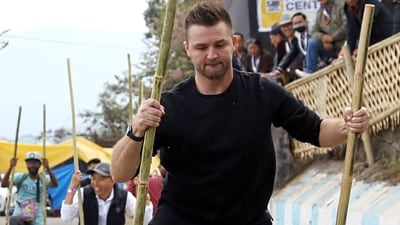 A foreigner participates in a bamboo stick race in the Hornbill festival in Kohima (ANI) A foreigner participates in a bamboo stick race in the Hornbill festival in Kohima (ANI)