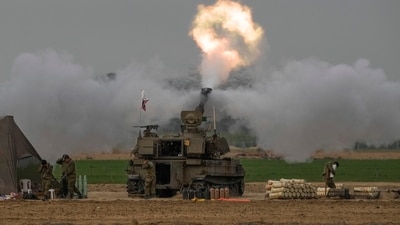 Israel-Hamas War: An Israeli mobile artillery unit fires a shell from southern Israel towards the Gaza Strip, in a position near the Israel-Gaza border. (AP) Israel-Hamas War: An Israeli mobile artillery unit fires a shell from southern Israel towards the Gaza Strip, in a position near the Israel-Gaza border. (AP)
