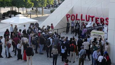Activists protest against fossil fuels at the COP28 UN Climate Summit, in Dubai, United Arab Emirates, on Sunday. (AP) Activists protest against fossil fuels at the COP28 UN Climate Summit, in Dubai, United Arab Emirates, on Sunday. (AP)