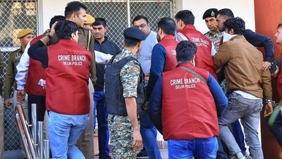 Jaipur: Rajasthan Police personnel and Delhi Police's Crime Branch arrive with accused of Shri Rashtriya Rajput Karni Sena's president Sukhdev Singh Gogamedi murder case at Sodala Police Station, in Jaipur, Sunday, Dec. 10, 2023. (PTI Photo)(PTI12_10_2023_000111B) Jaipur: Rajasthan Police personnel and Delhi Police's Crime Branch arrive with accused of Shri Rashtriya Rajput Karni Sena's president Sukhdev Singh Gogamedi murder case at Sodala Police Station, in Jaipur, Sunday, Dec. 10, 2023. (PTI Photo)(PTI12_10_2023_000111B)