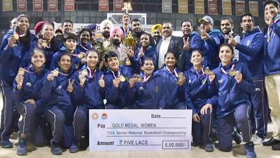 Railways women’s teams with the winners’ trophies at the 73rd Basketball National Championships in Ludhiana. (Manish/HT)
