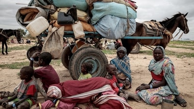 FILE PHOTO: A Sudanese family who fled the conflict in Murnei in Sudan's Darfur region, sit beside their belongings while waiting to be registered by UNHCR upon crossing the border between Sudan and Chad in Adre, Chad, July 26, 2023. (REUTERS)