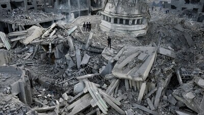 Palestinians inspect the rubble of the Yassin Mosque destroyed after it was hit by an Israeli airstrike at Shati refugee camp in Gaza City, early Monday, Oct. 9, 2023. (AP Photo/Adel Hana)
