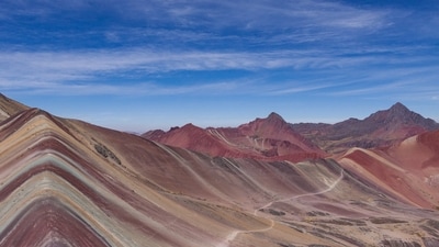Vinicunca, Peru: Also known as the “Rainbow Mountain,” the vibrant colors of Peru’s Vinicunca, featuring pink and yellow streaks, are a result of mineral deposits. The optimal time to visit is during the dry season, from May to September, for clearer views and reduced rainfall. (Unsplash) Vinicunca, Peru: Also known as the “Rainbow Mountain,” the vibrant colors of Peru’s Vinicunca, featuring pink and yellow streaks, are a result of mineral deposits. The optimal time to visit is during the dry season, from May to September, for clearer views and reduced rainfall. (Unsplash)