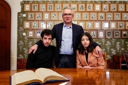 Iranian journalist Taghi Rahmani (C), husband of this year's winner of the Nobel Peace Prize, Iranian human rights activist Narges Mohammadi (not in picture), and their children Ali Rahmani (L) and Kiana Rahmani (R) pose for a picture after signing the guest book at the Nobel Institute in Oslo, Norway, on December 9, 2023. (AFP) Iranian journalist Taghi Rahmani (C), husband of this year's winner of the Nobel Peace Prize, Iranian human rights activist Narges Mohammadi (not in picture), and their children Ali Rahmani (L) and Kiana Rahmani (R) pose for a picture after signing the guest book at the Nobel Institute in Oslo, Norway, on December 9, 2023. (AFP)