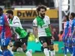 Liverpool's Mohamed Salah, centre, celebrates after scoring his side's opening goal during the Premier League soccer match between Crystal Palace and Liverpool at Selhurst Park