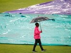 A match official inspects the pitch after rain delayed the start of play ahead of the first T20 cricket match between South Africa and India A match official inspects the pitch after rain delayed the start of play ahead of the first T20 cricket match between South Africa and India