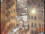 Video showed a corner of the six-story building with its walls sheared off and floors sagging, and a heap of rubble in the street. (Twitter)