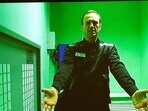 Russian opposition leader Alexei Navalny is seen on a TV screen.