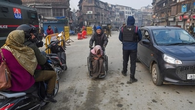 Police personnel conduct checks after security tightened to maintain law and order ahead of the Supreme Court's verdict on Article 370 in Srinagar. (ANI) Police personnel conduct checks after security tightened to maintain law and order ahead of the Supreme Court's verdict on Article 370 in Srinagar. (ANI)