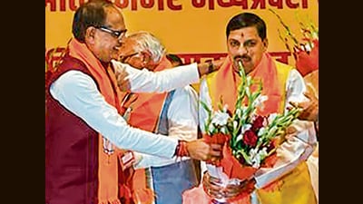BJP leader Mohan Yadav being felicitated by outgoing chief minister Shivraj Singh Chouhan in Bhopal on Monday. (ANI) BJP leader Mohan Yadav being felicitated by outgoing chief minister Shivraj Singh Chouhan in Bhopal on Monday. (ANI)