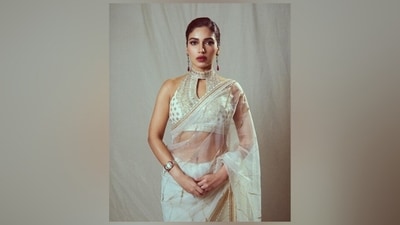 The Gopi Vaid drape comes in a see-through silhouette featuring gold gota patti embroidery, gold thread embroidered borders, and sequin designs on the pallu. She wore the saree in traditional style, letting the pallu fall from her shoulder in an elegant floor-sweeping length and made neat pleats in the front. (Instagram) The Gopi Vaid drape comes in a see-through silhouette featuring gold gota patti embroidery, gold thread embroidered borders, and sequin designs on the pallu. She wore the saree in traditional style, letting the pallu fall from her shoulder in an elegant floor-sweeping length and made neat pleats in the front. (Instagram)