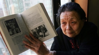 AIDS activist Gao Yaojie displays a book she wrote about AIDS in China (AP) AIDS activist Gao Yaojie displays a book she wrote about AIDS in China (AP)