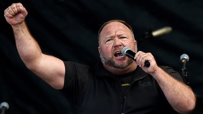 (FILES) Elon Musk, the billionaire owner of X, on December 10, 2023 reinstated far-right conspiracy theorist Alex Jones on the social media platform, a year after vowing never to let him return. Jones, who claimed that a December 2012 school shooting in Newtown, Connecticut, that killed 20 children and six educators was a hoax, was banned from the platform. (Photo by Olivier DOULIERY / AFP) (AFP) (FILES) Elon Musk, the billionaire owner of X, on December 10, 2023 reinstated far-right conspiracy theorist Alex Jones on the social media platform, a year after vowing never to let him return. Jones, who claimed that a December 2012 school shooting in Newtown, Connecticut, that killed 20 children and six educators was a hoax, was banned from the platform. (Photo by Olivier DOULIERY / AFP) (AFP)