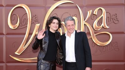 Timothée Chalamet, of course, is portraying the literary figure at the heart of the film, Willy Wonka. Hugh Grant plays an Oompa-Loompa named Lofty. The actors posed together at Wonka's LA premiere at Regency Village Theatre. (REUTERS)