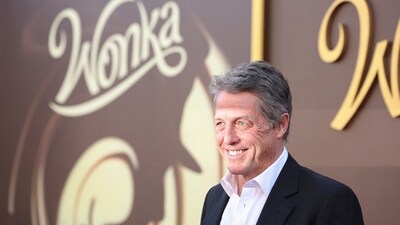 Hugh Grant attends a premiere for the film Wonka in Los Angeles on Sunday. In a recent interview with People, Hugh had joked that he was a 'bit nervous' of co-star Timothée Chalamet but ‘did warm to him.’. (REUTERS)