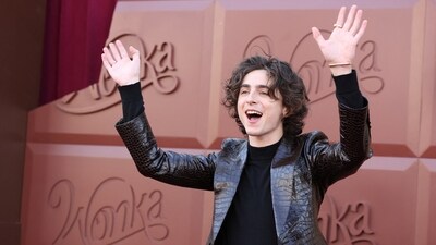 Timothée Chalamet attended Los Angeles premiere of Wonka in a sleek black look and seemed in high spirits as he posed solo on the red carpet. Wonka is a prequel to Roald Dahl's beloved Charlie and the Chocolate Factory. (REUTERS)