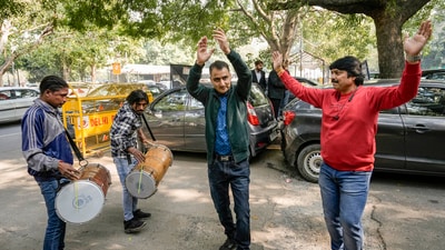 Kashmiri Hindus react after the Supreme Court upheld the Centre's decision to abrogate Article 370 of the Constitution, outside the court in New Delhi. (PTI) Kashmiri Hindus react after the Supreme Court upheld the Centre's decision to abrogate Article 370 of the Constitution, outside the court in New Delhi. (PTI)