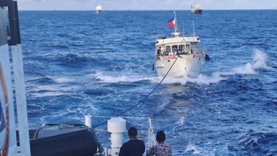 A Chinese Coast Guard ship, right, uses its water cannons on a Philippine Bureau of Fisheries and Aquatic Resources (BFAR) vessel. (AP) A Chinese Coast Guard ship, right, uses its water cannons on a Philippine Bureau of Fisheries and Aquatic Resources (BFAR) vessel. (AP)