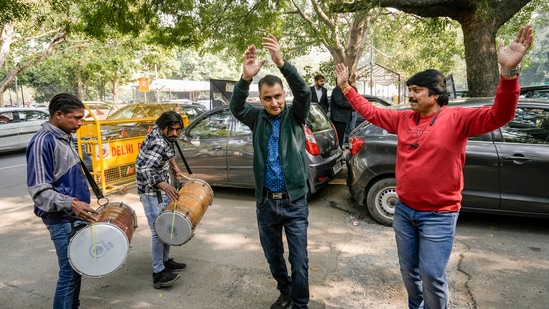 Kashmiri Hindus react after the Supreme Court upheld the Centre's decision to abrogate Article 370 of the Constitution, outside the court in New Delhi.(PTI)