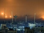 A picture taken from Rafah shows flares amids smoke over Khan Yunis in the southern Gaza Strip during Israeli strikes. (AFP) A picture taken from Rafah shows flares amids smoke over Khan Yunis in the southern Gaza Strip during Israeli strikes. (AFP)