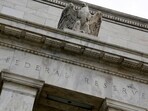 FILE PHOTO: An eagle tops the U.S. Federal Reserve building's facade in Washington, July 31, 2013. REUTERS/Jonathan Ernst/File Photo
